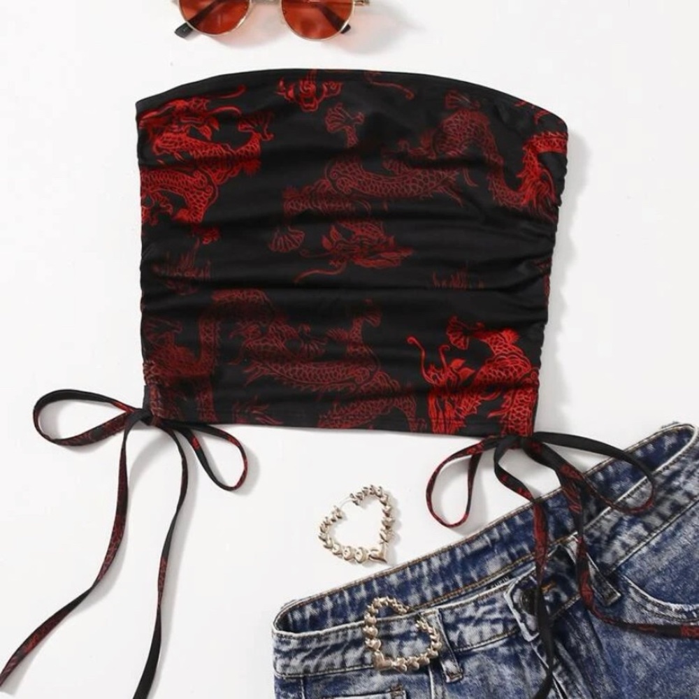 Strapless red and black dragon print top with ruching and ties on the sides